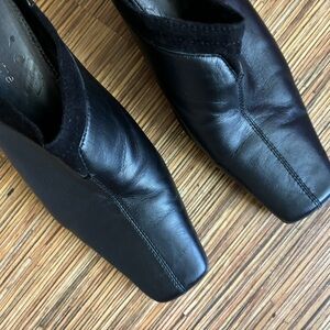 Black Leather Mules with suede accent trim. Size 7.